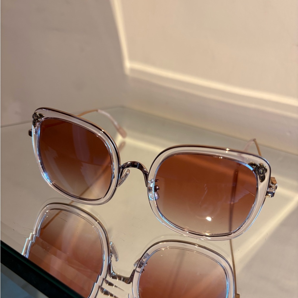 Coach pink lenses with rhinestone side design.